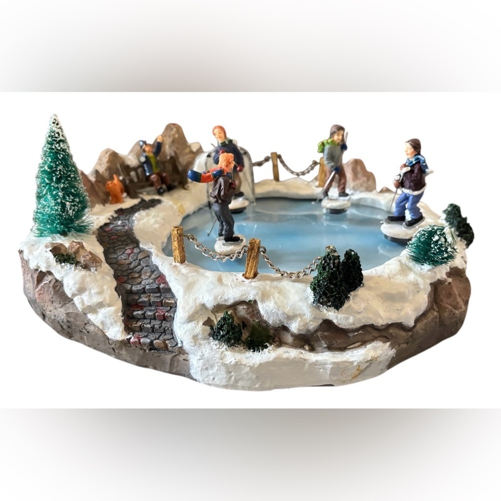hockey music pond in original box
figurines (4) with music.